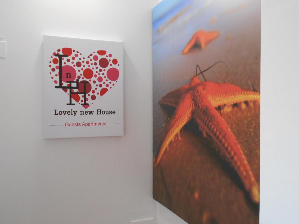 a book next to a picture of a cake at Lovely new House - Guests Apartments in Olhão