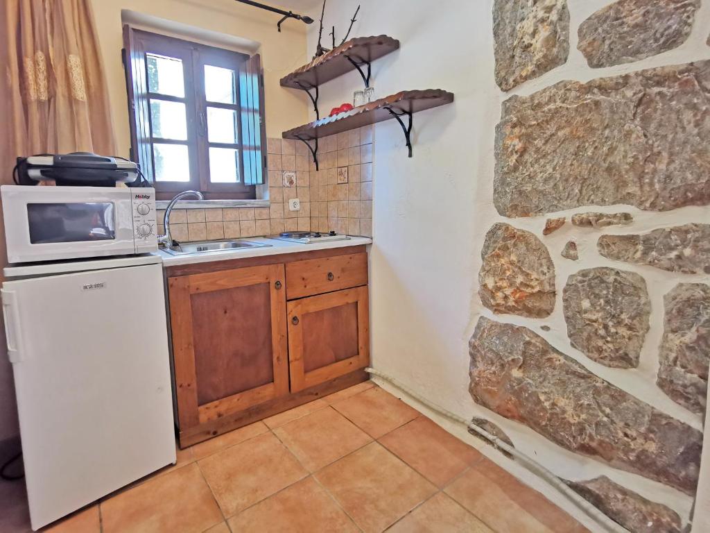Kuchyňa alebo kuchynka v ubytovaní Guesthouse Toxotis