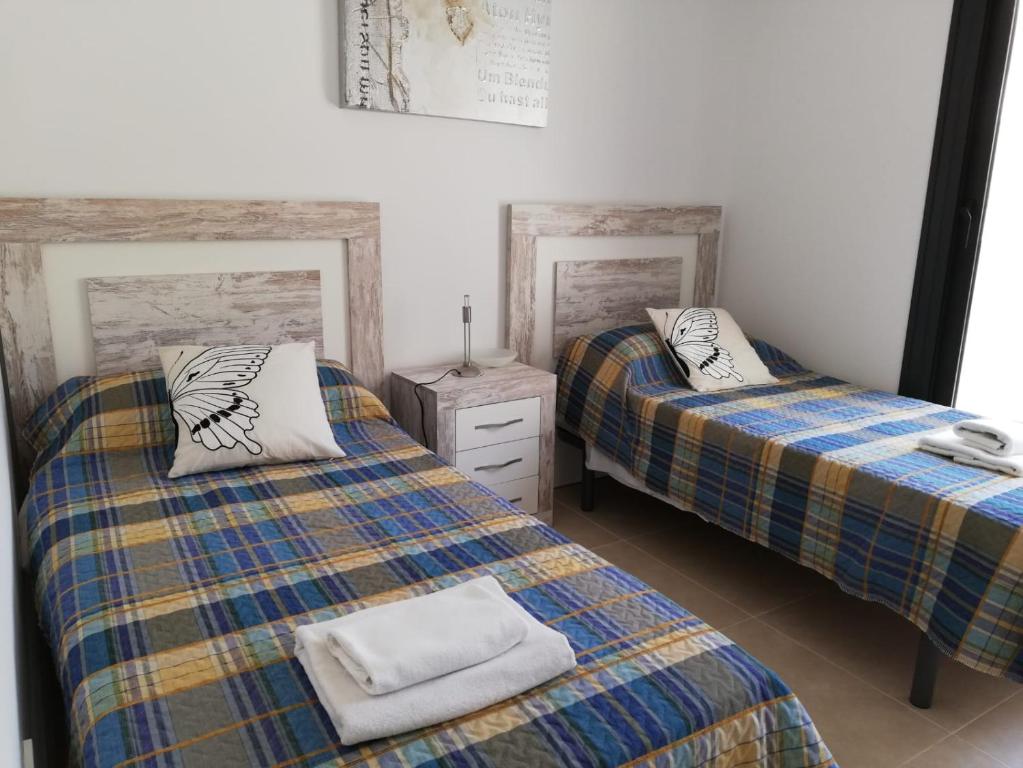 Postel nebo postele na pokoji v ubytování Terrazas de las Marinas