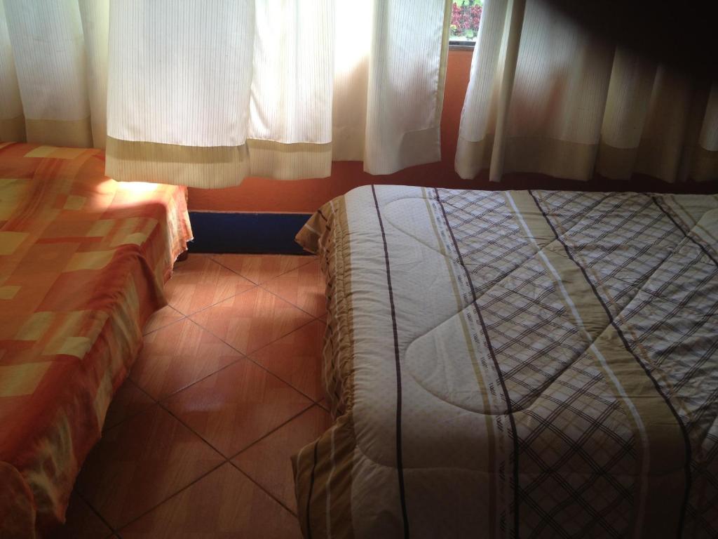 Postel nebo postele na pokoji v ubytování Hospedaje Rocha