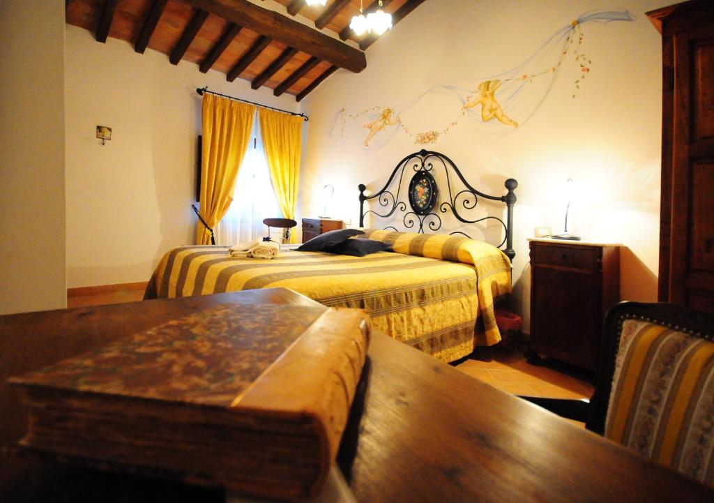 Postel nebo postele na pokoji v ubytování B&B Camere La Vite