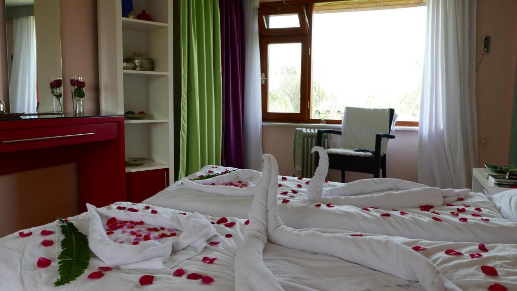 Postel nebo postele na pokoji v ubytování Aida Hotel