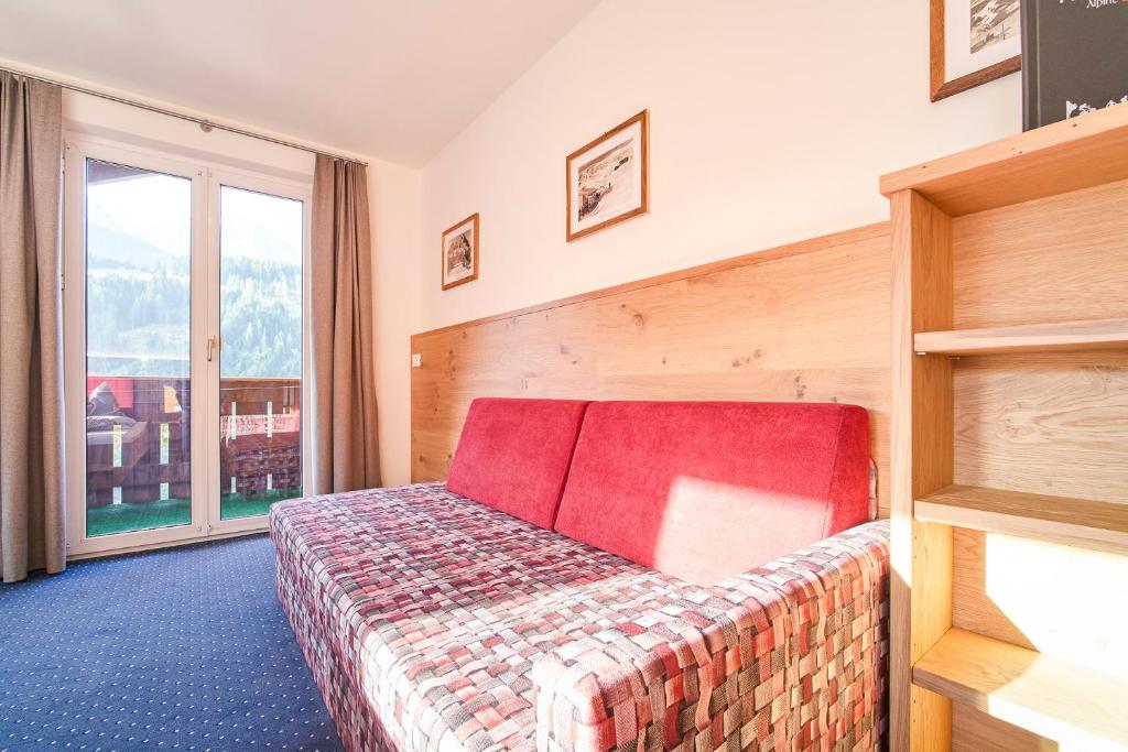 Postel nebo postele na pokoji v ubytování Kedul Lodge