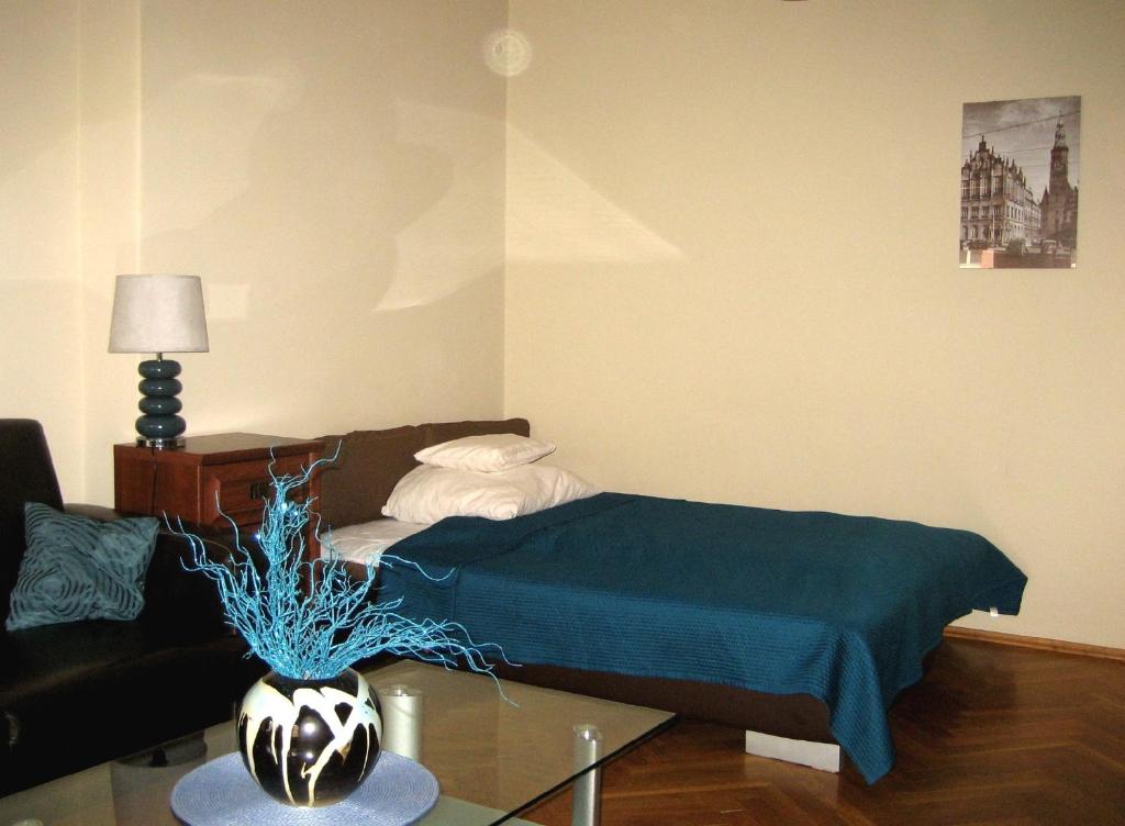 Posteľ alebo postele v izbe v ubytovaní Apartament Central