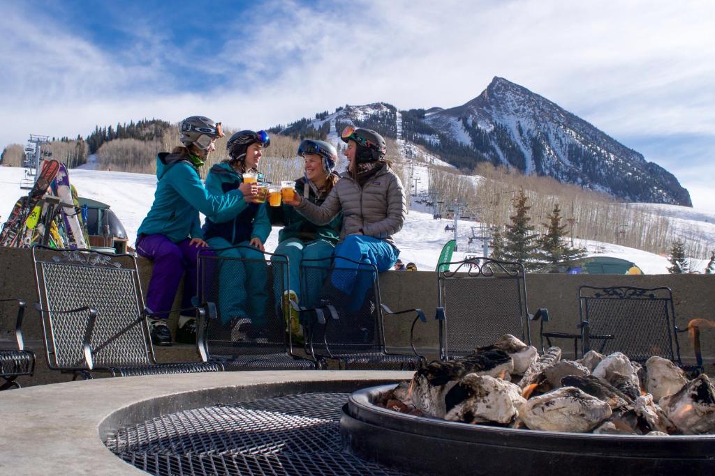 a group of people riding in a ski lift at Elevation Hotel & Spa in Crested Butte