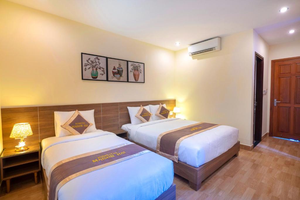 Giường trong phòng chung tại Maison Hai Homestay Hoi An