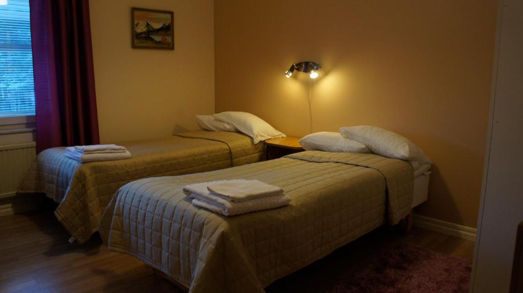 Postel nebo postele na pokoji v ubytování Hotell Vindelngallerian