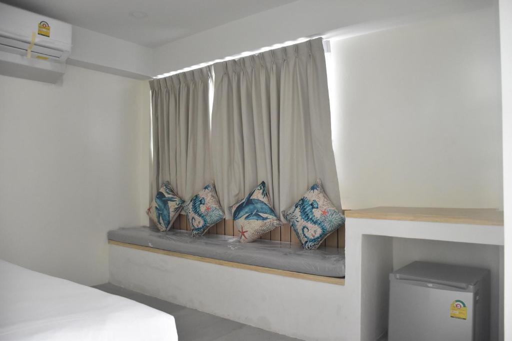 Postel nebo postele na pokoji v ubytování Stay Inn Nathon Samui