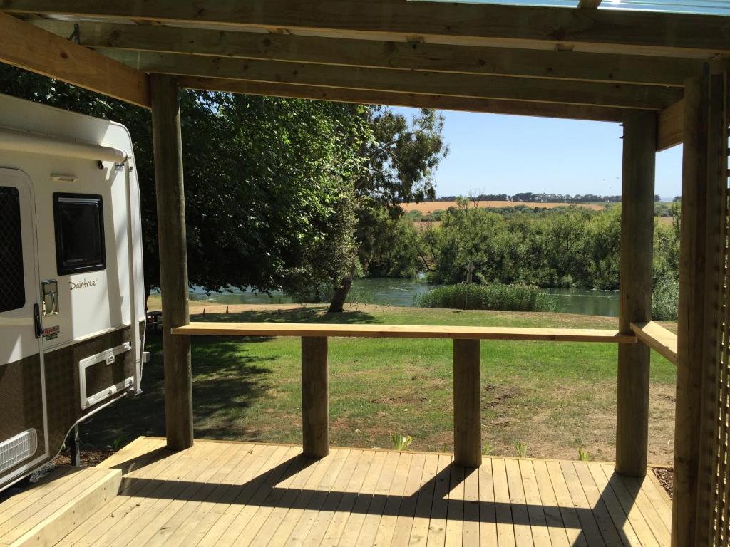 a view from the front porch of a camper with a view of a river at Longford Riverside Caravan Park in Longford