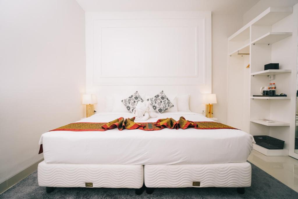Postel nebo postele na pokoji v ubytování Alam Hotel by Cordela