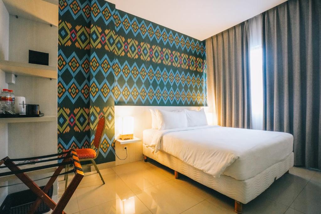 Postel nebo postele na pokoji v ubytování Alam Hotel by Cordela