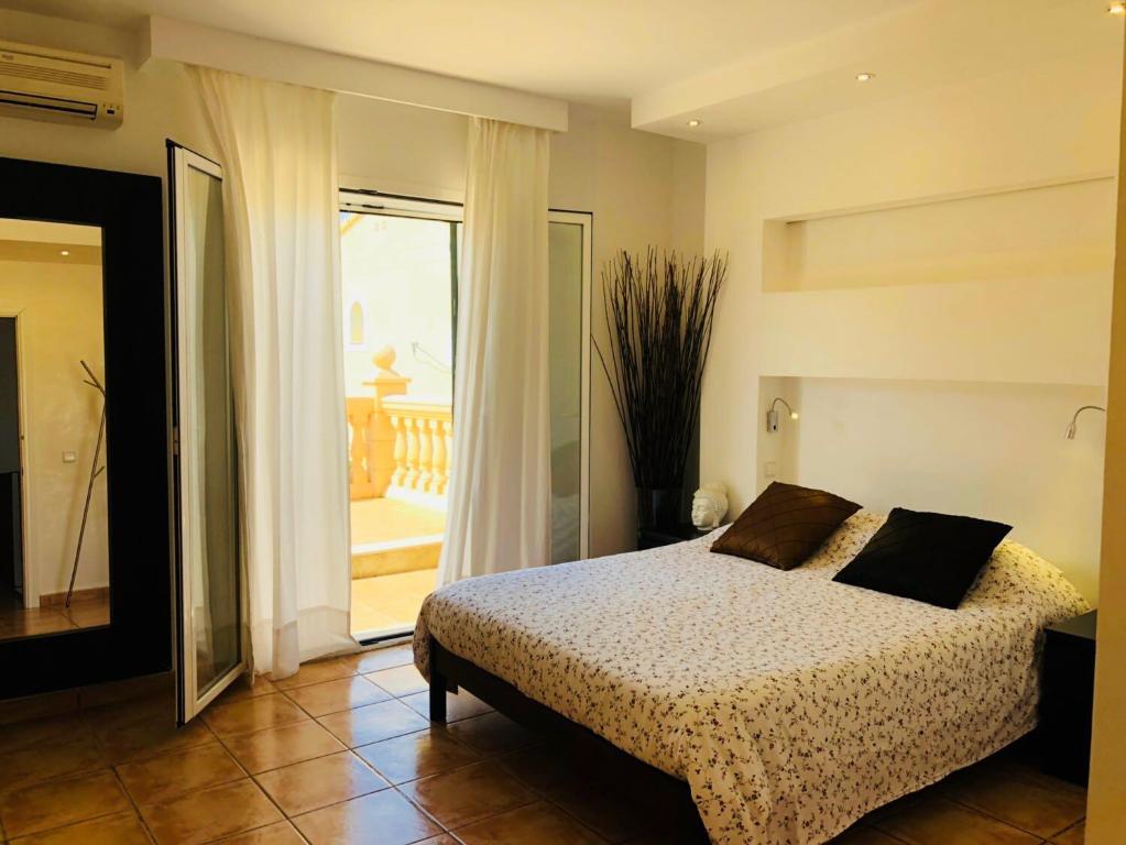 Postel nebo postele na pokoji v ubytování Villas2meet Mallorca