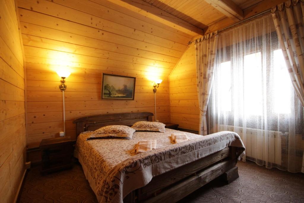 Postel nebo postele na pokoji v ubytování Palaga Bukovel