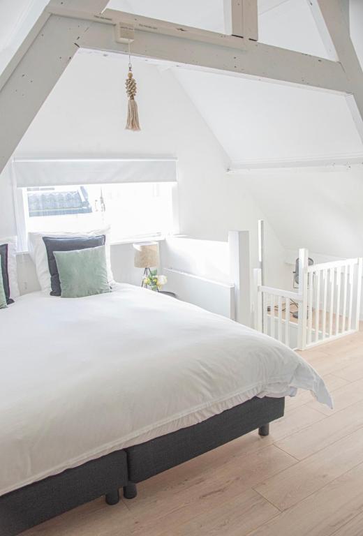 Postel nebo postele na pokoji v ubytování Tiny House Lindenhouse