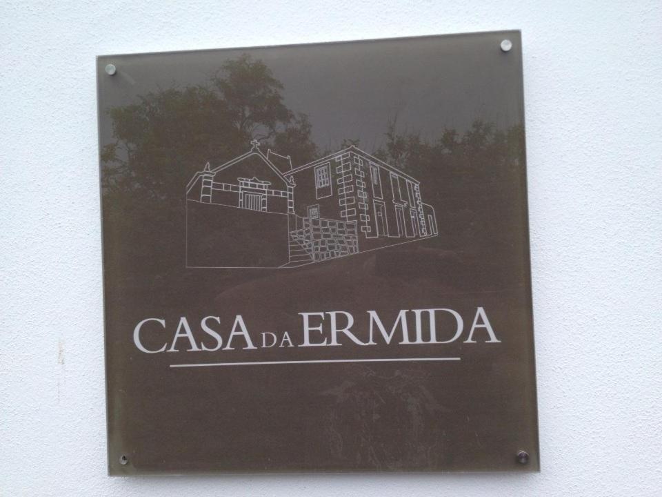 a sign for a casa erimimo building at Casa da Ermida in Velas