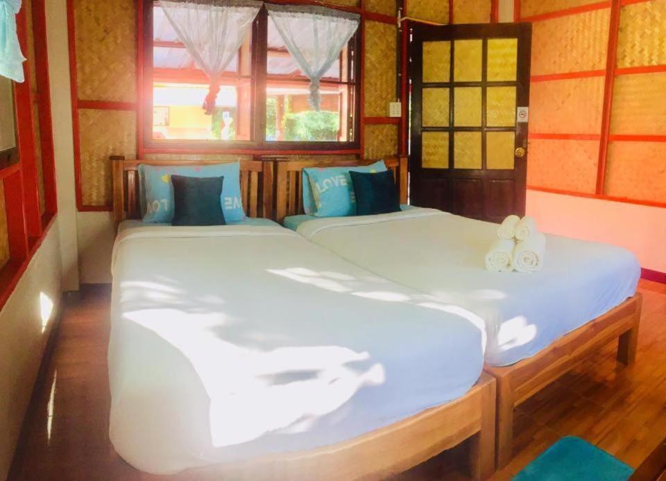 Postel nebo postele na pokoji v ubytování Yayee Homestay