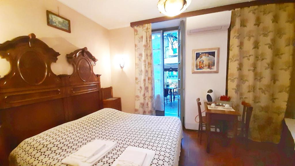 Postel nebo postele na pokoji v ubytování B&B La Veranda - Iseo