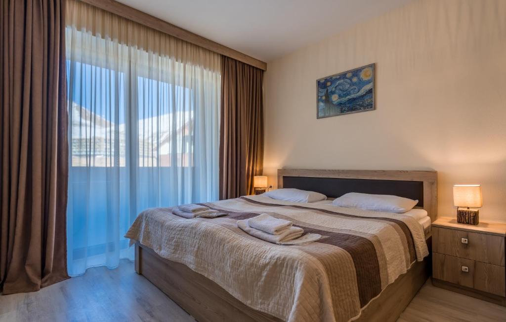 Postel nebo postele na pokoji v ubytování New Gudauri Block 4, Gondola apartment