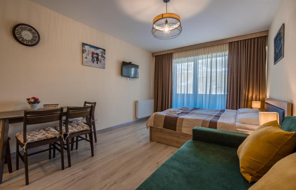Postel nebo postele na pokoji v ubytování New Gudauri Block 4, Gondola apartment