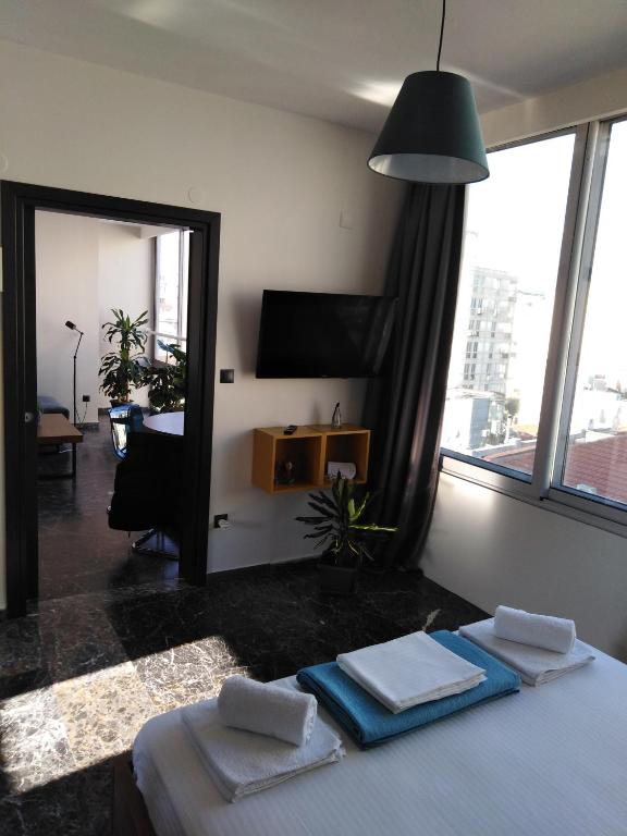 Łóżko lub łóżka w pokoju w obiekcie Ladadika 5th Floor