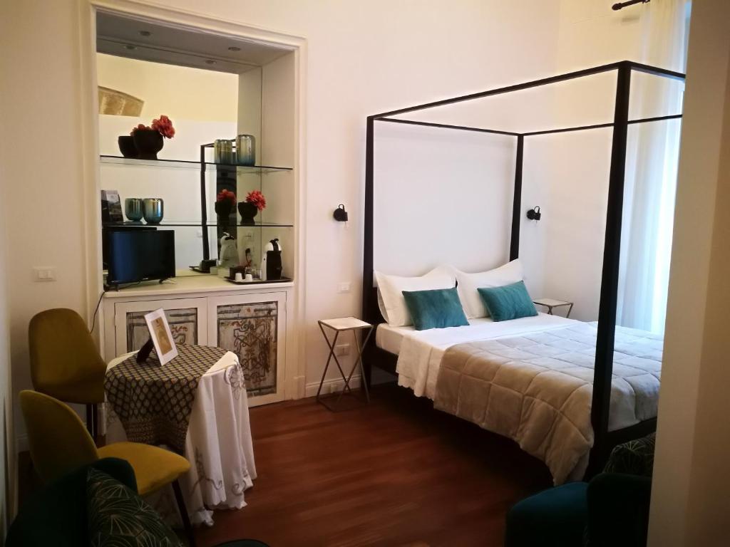 Postel nebo postele na pokoji v ubytování Il Rosone Luxury B&B