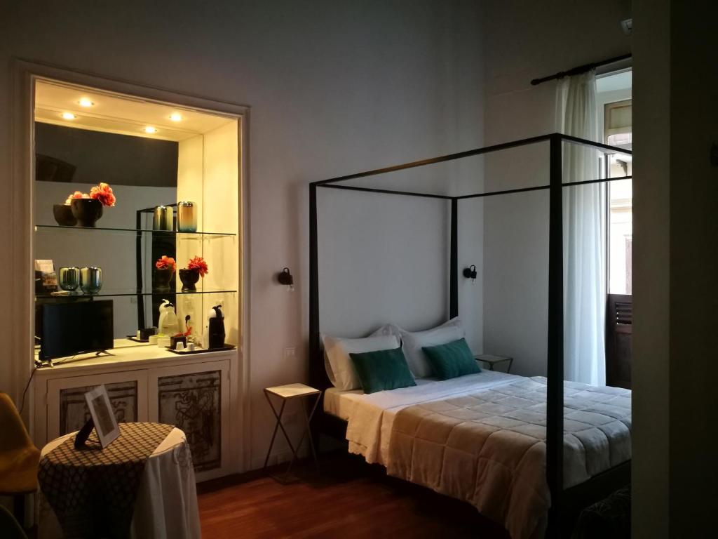 Postel nebo postele na pokoji v ubytování Il Rosone Luxury B&B