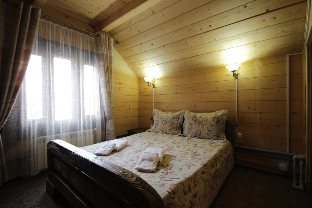Postel nebo postele na pokoji v ubytování Palaga Bukovel