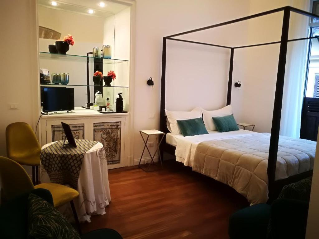 Postel nebo postele na pokoji v ubytování Il Rosone Luxury B&B