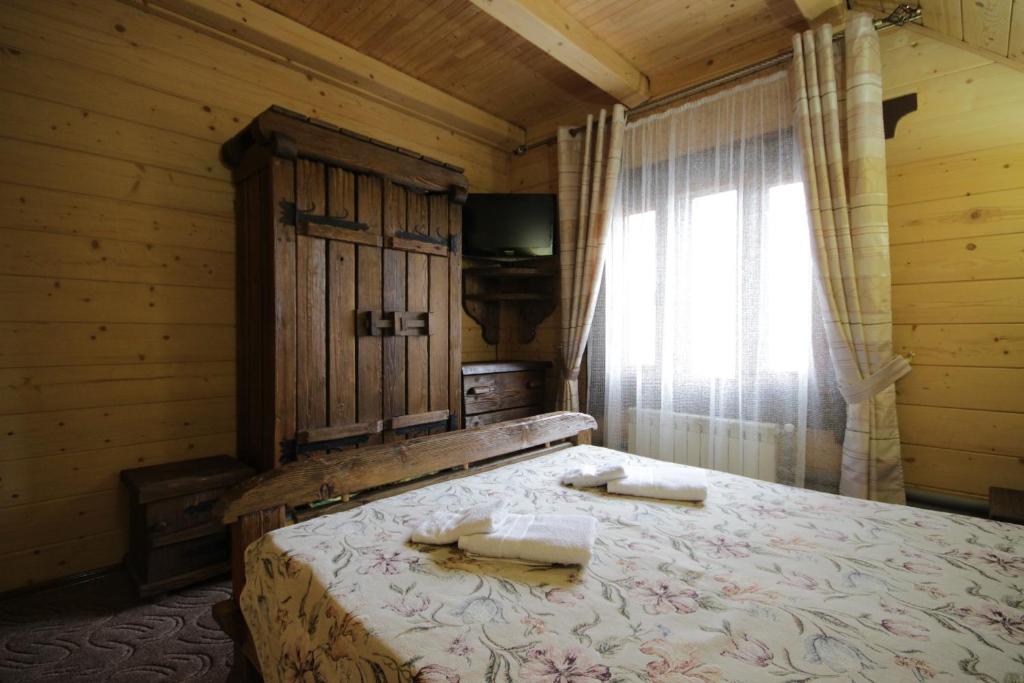 Postel nebo postele na pokoji v ubytování Palaga Bukovel