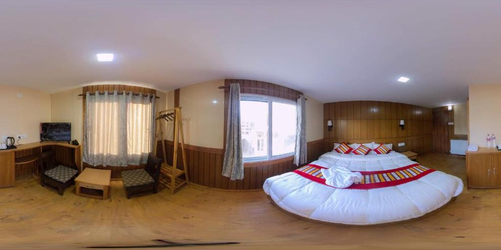 Postel nebo postele na pokoji v ubytování Hotel Grand Shambala