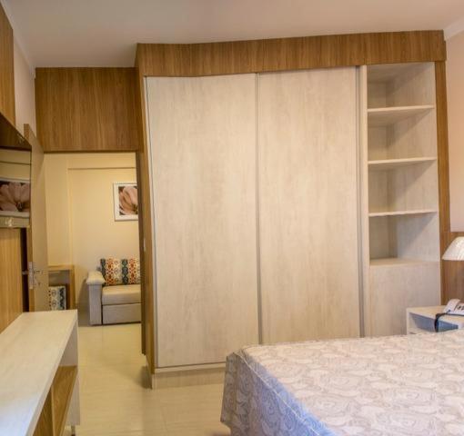 Cama ou camas em um quarto em Piazza DiRoma Caldas Novas