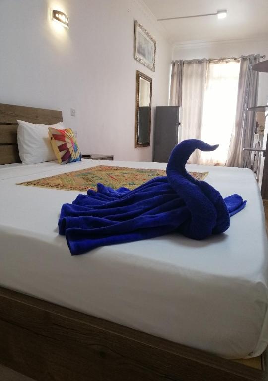 Postel nebo postele na pokoji v ubytování Easy Stay Residence
