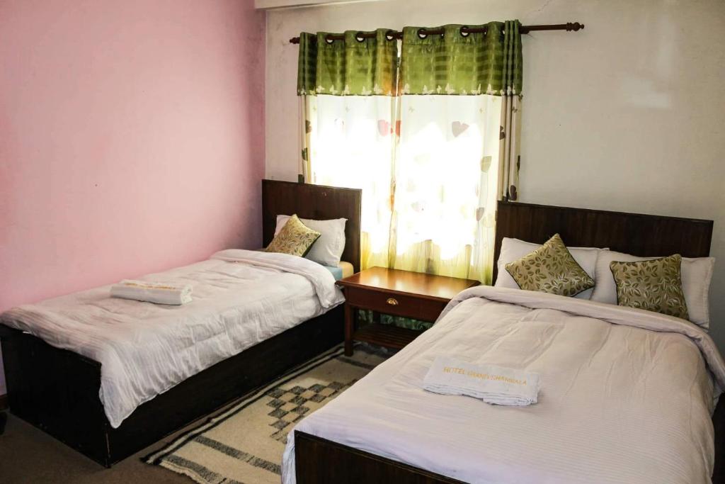 Postel nebo postele na pokoji v ubytování Hotel Grand Shambala