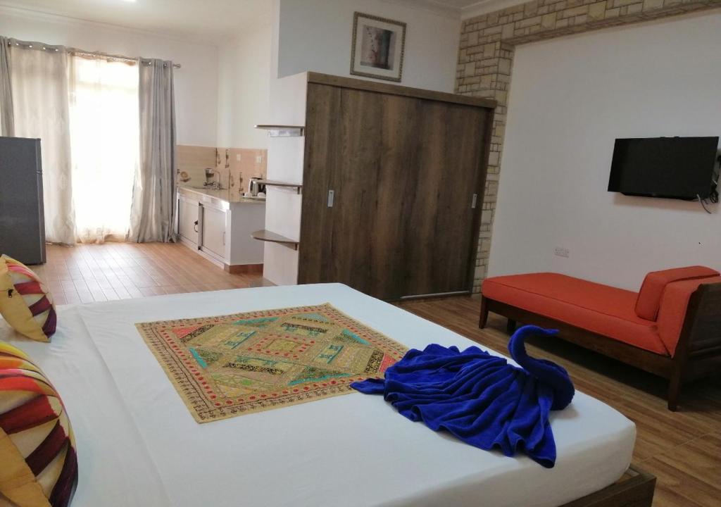 Postel nebo postele na pokoji v ubytování Easy Stay Residence