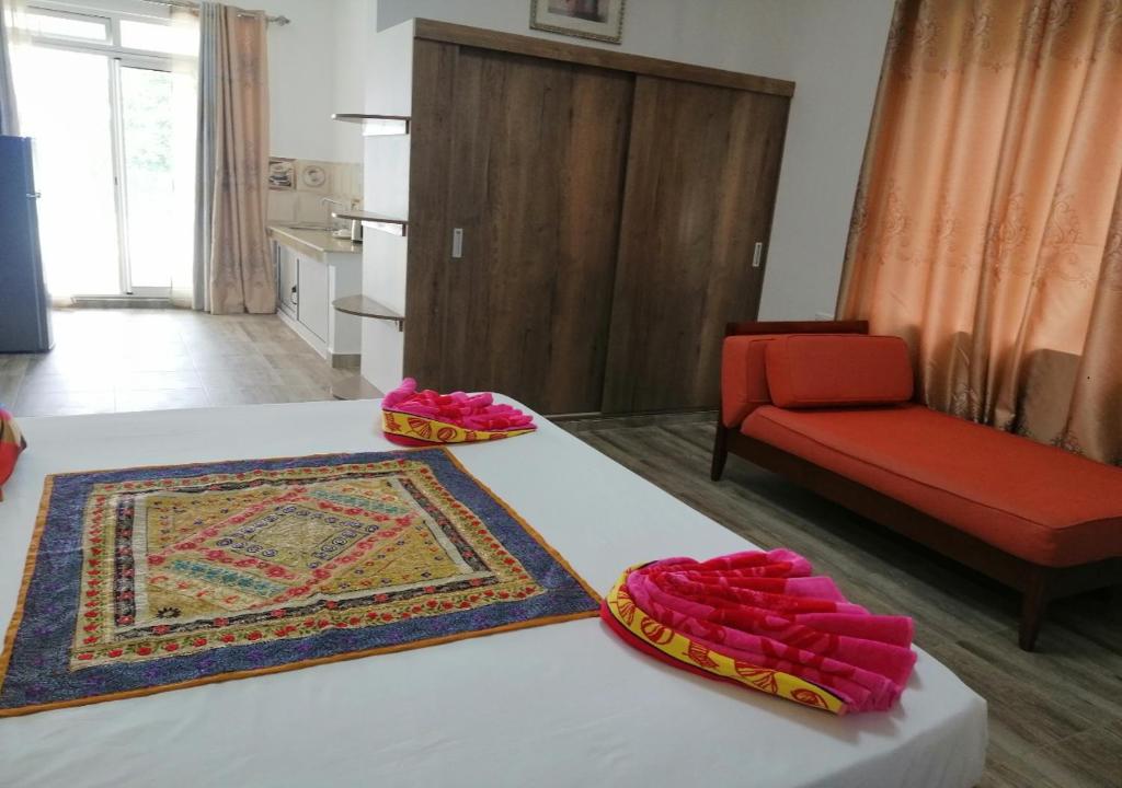 Postel nebo postele na pokoji v ubytování Easy Stay Residence