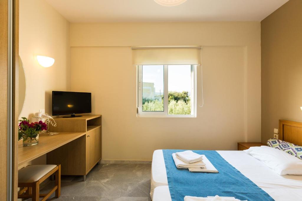 Postel nebo postele na pokoji v ubytování Radamanthy's Hotel Apartments
