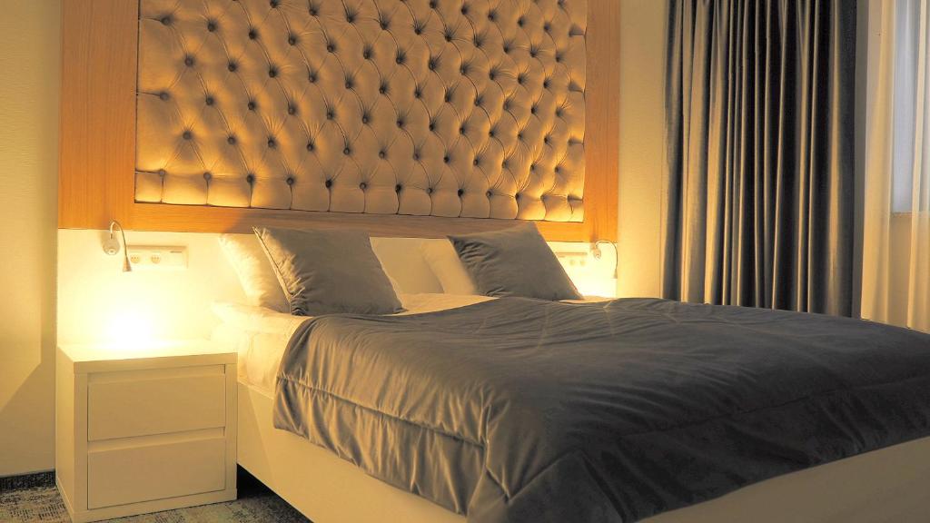 Posteľ alebo postele v izbe v ubytovaní Hotel Sjesta