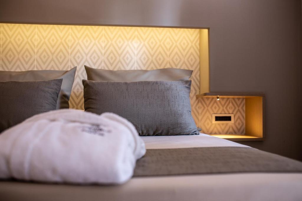 Een bed of bedden in een kamer bij Hotel Corte Rosada