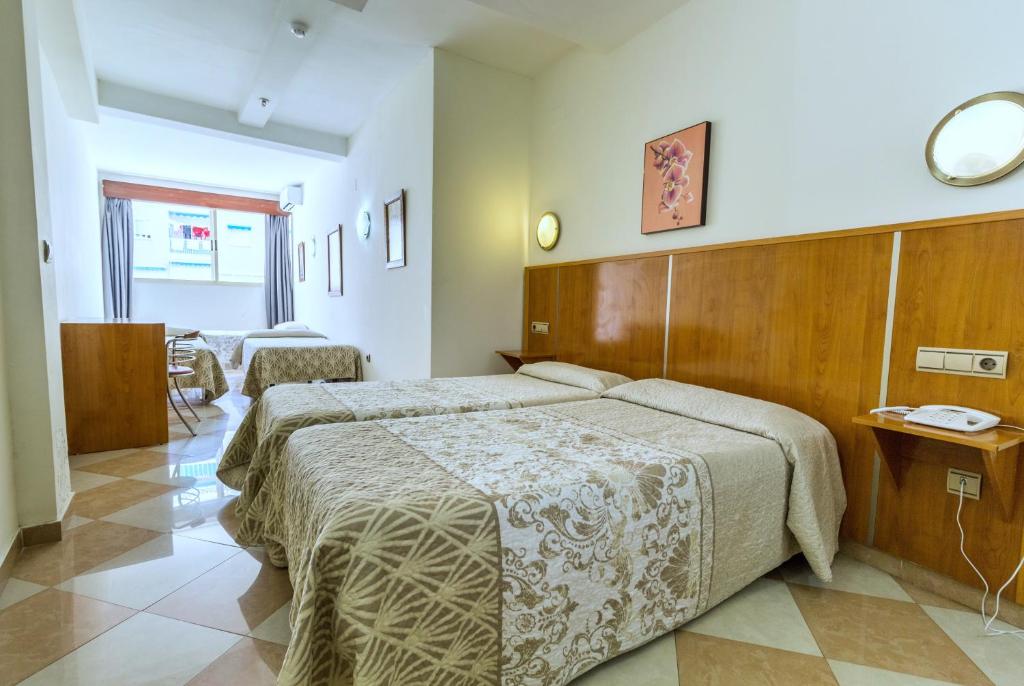 Postel nebo postele na pokoji v ubytování Nch Hotel Torremolinos