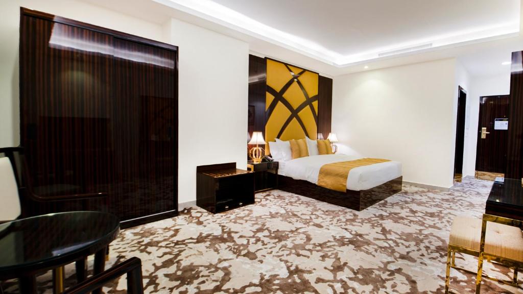 Postel nebo postele na pokoji v ubytování Golden Dream Hotel