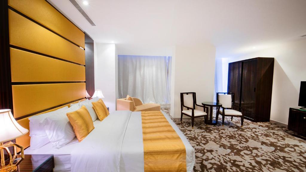 Postel nebo postele na pokoji v ubytování Golden Dream Hotel