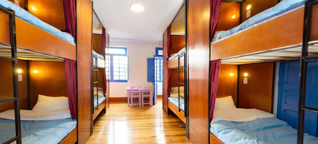 Postel nebo postele na pokoji v ubytování Granada Hostel