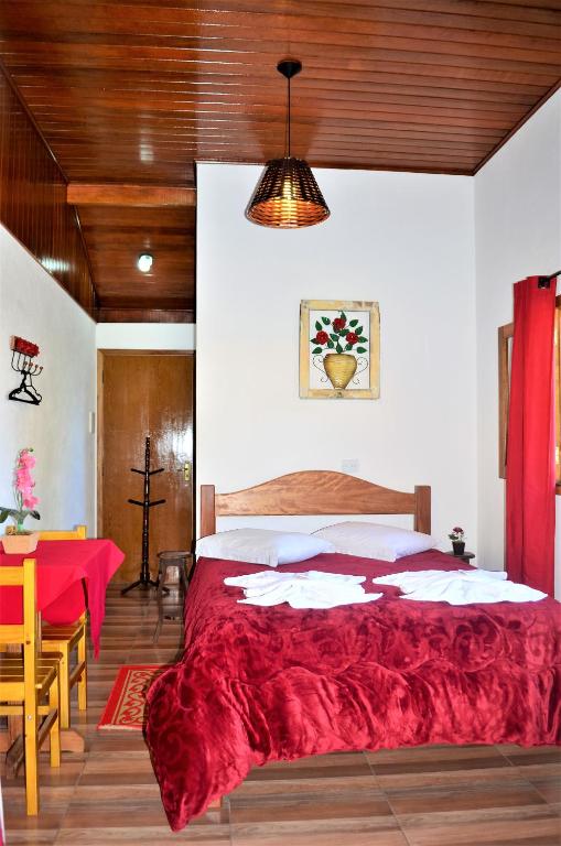 Postel nebo postele na pokoji v ubytování Chalés Fazenda Vale da Mata