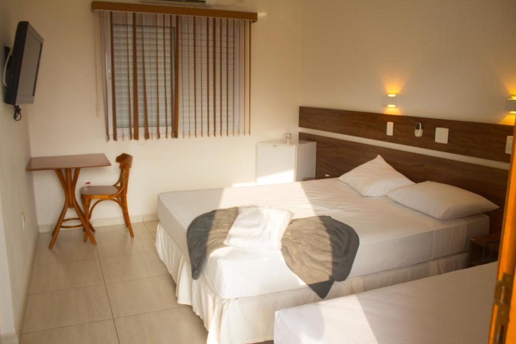 Postel nebo postele na pokoji v ubytování Hotel Garrafão - Rua Principal de Boituva