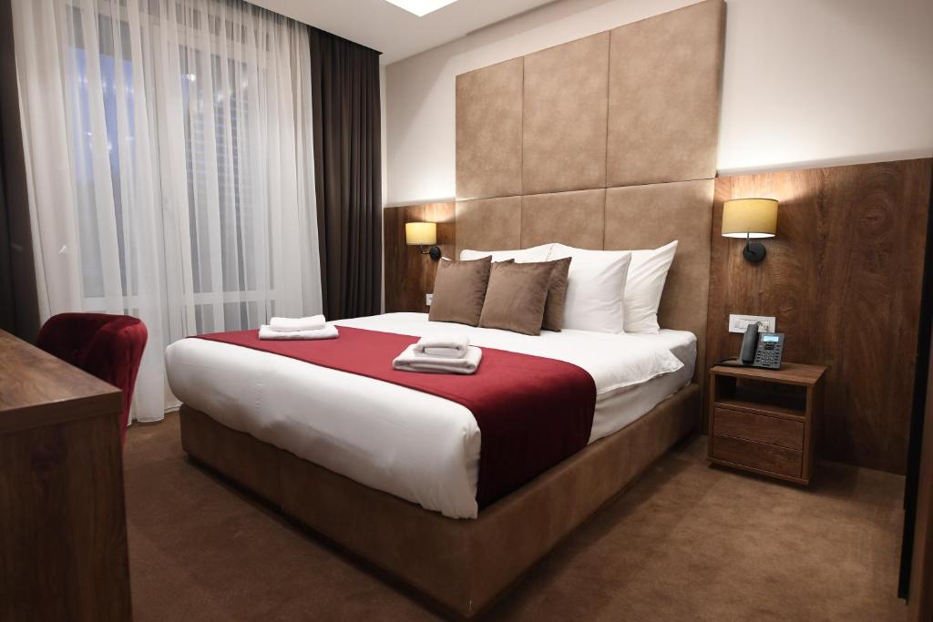 Postel nebo postele na pokoji v ubytování Hammeum Hotel