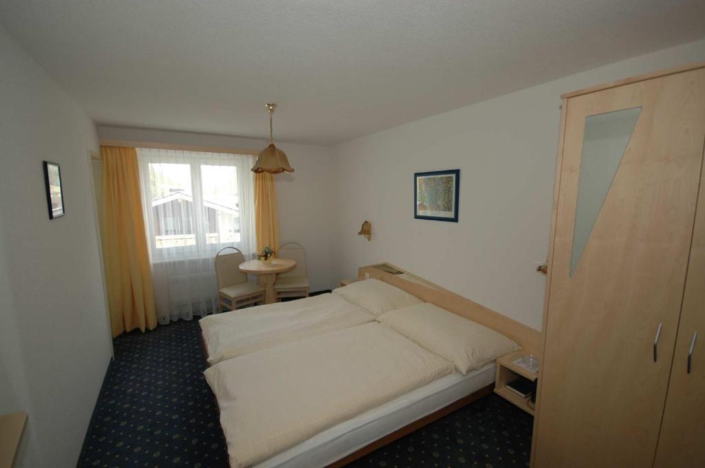 Postel nebo postele na pokoji v ubytování Hotel Alpha