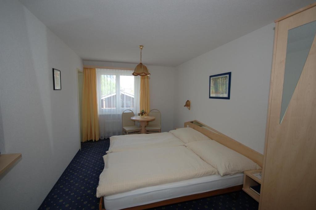 Postel nebo postele na pokoji v ubytování Hotel Alpha