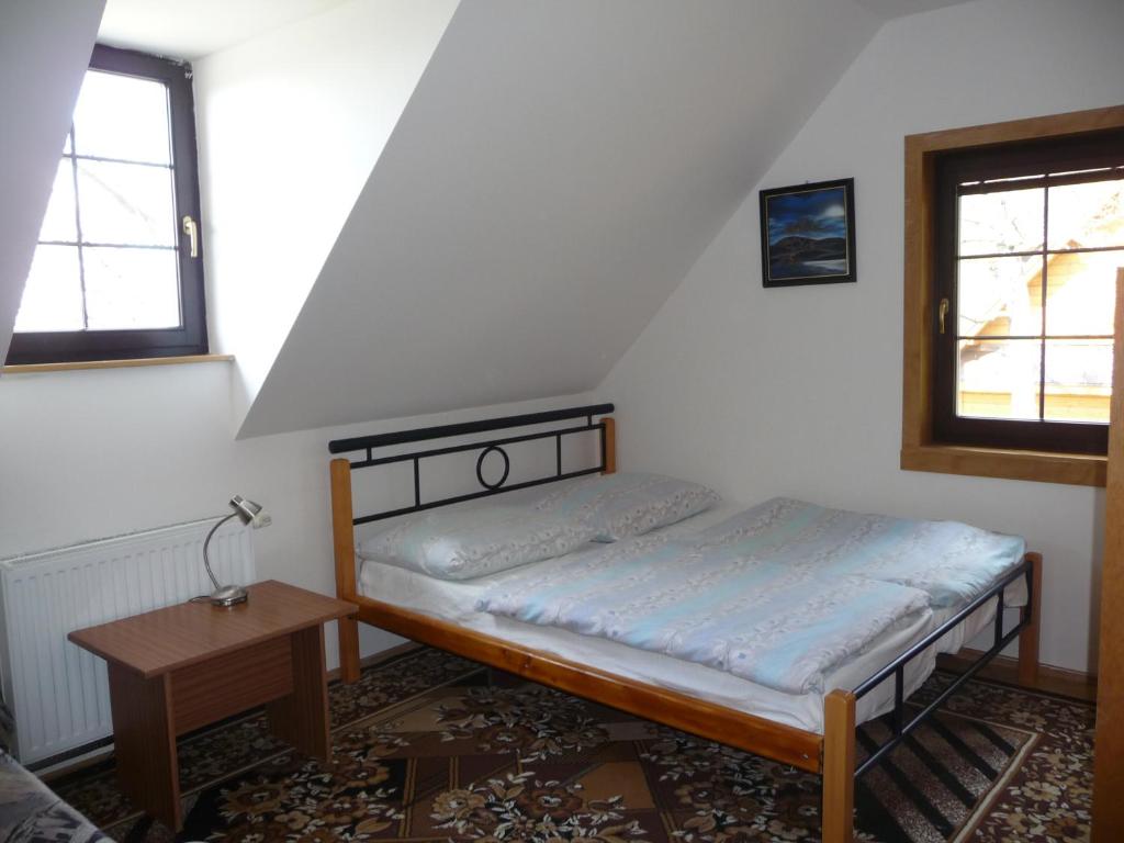 Postel nebo postele na pokoji v ubytování Chata na Pustevnách