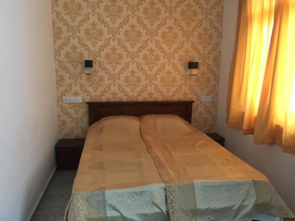 Postel nebo postele na pokoji v ubytování Sea Sands Beach Hostel