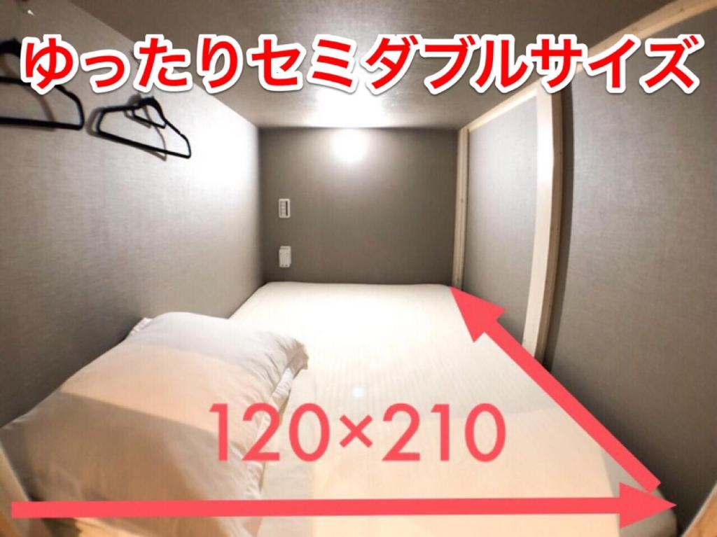 Postel nebo postele na pokoji v ubytování ゲストハウス888 女性専用ドミトリー